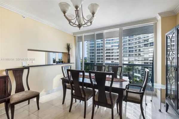 a kitchen with kitchen island granite countertop a sink stove and cabinets
