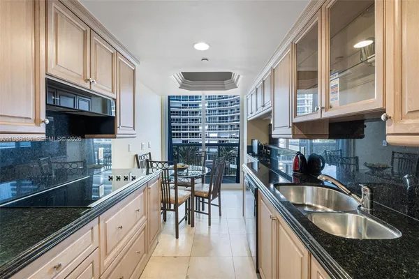 a hallway with wooden floor electronic appliances and window