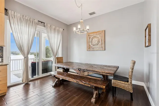 a bathroom with a granite countertop sink mirror and a bathtub