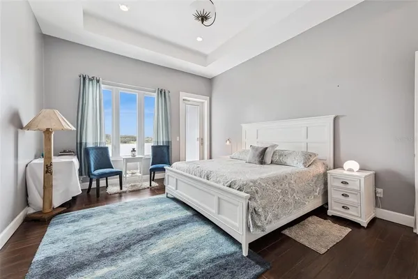 a bathroom with a granite countertop sink a mirror and vanity