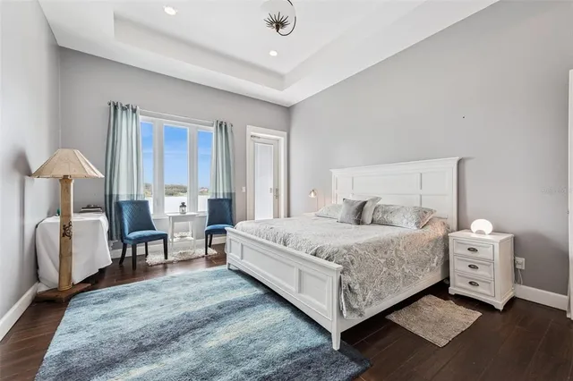 a bathroom with a granite countertop sink a mirror and vanity