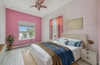 a bedroom with bed and a lamp