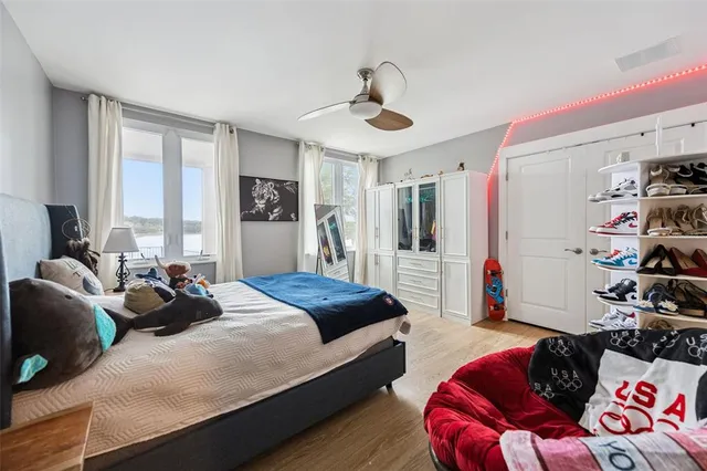 a living room with furniture gym equipment and a view of kitchen