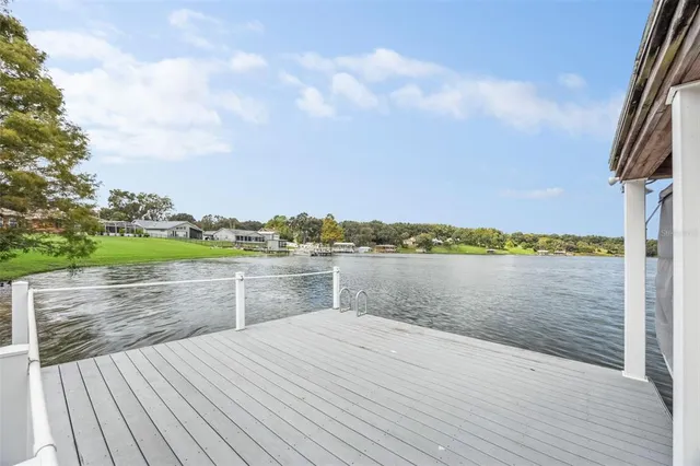 an aerial view of a house with a swimming pool