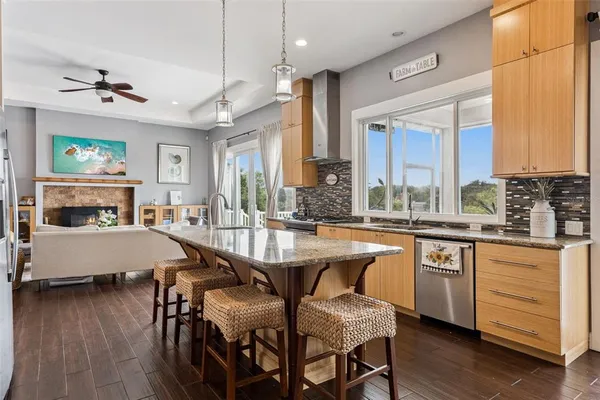 a large kitchen with a table and chairs