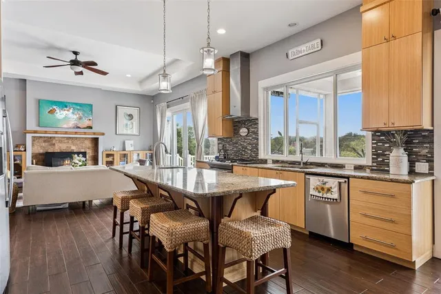 a large kitchen with a table and chairs