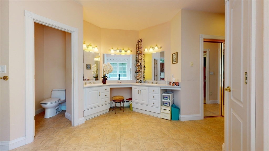 40 Country Club Drive Bridgewater, MA 02324 - Photo 23 of 39 a bathroom with a sink vanity mirror and toilet