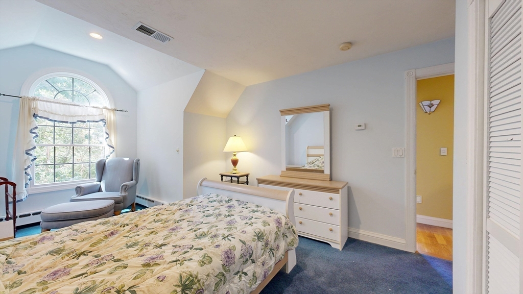 40 Country Club Drive Bridgewater, MA 02324 - Photo 29 of 39 a spacious bedroom with a bed and wooden floor