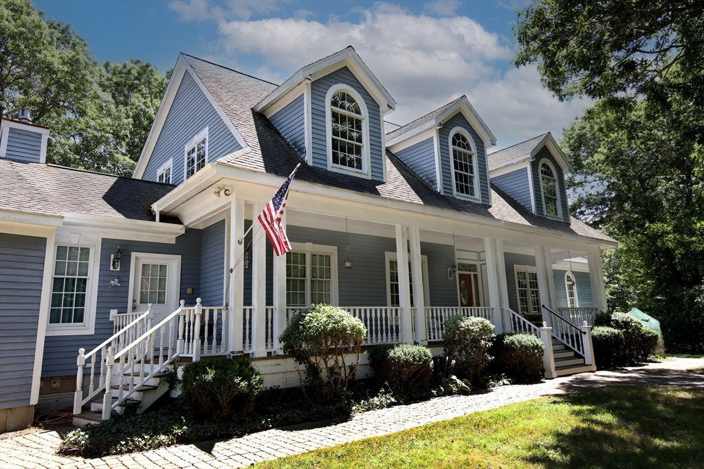 40 Country Club Drive Bridgewater, MA 02324 - Photo 3 of 39 a front view of a house with a garden