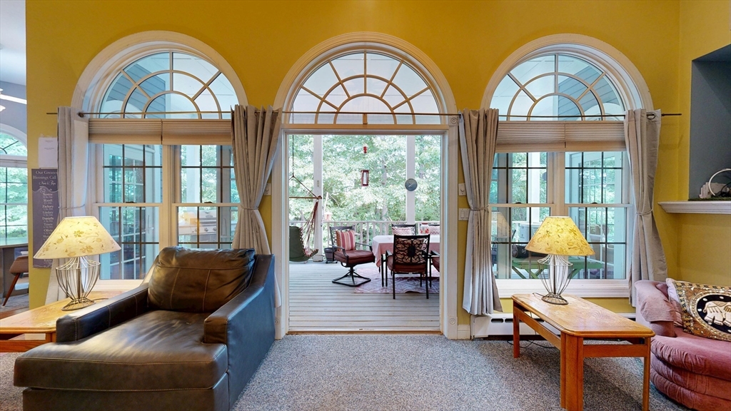 40 Country Club Drive Bridgewater, MA 02324 - Photo 31 of 39 a living room with furniture a fireplace and a large window