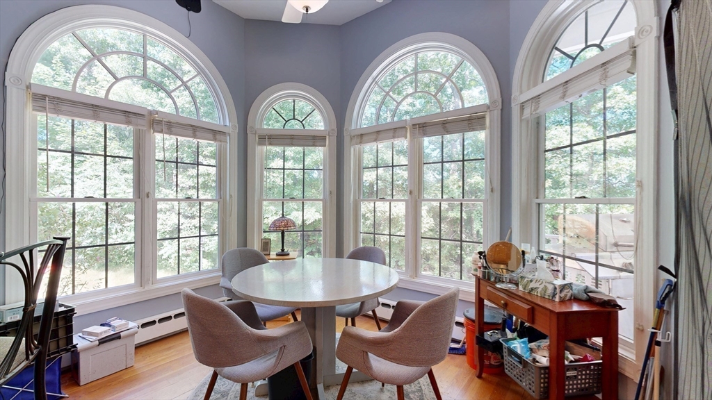 40 Country Club Drive Bridgewater, MA 02324 - Photo 8 of 39 a view of a dining room with furniture a chandelier and wooden floor