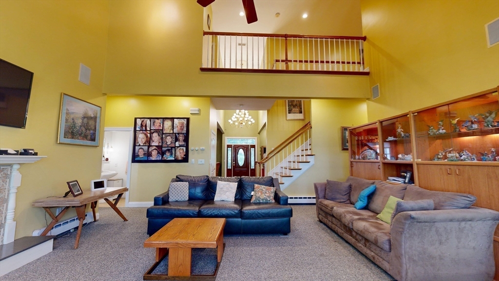 40 Country Club Drive Bridgewater, MA 02324 - Photo 10 of 39 a living room with furniture and a flat screen tv