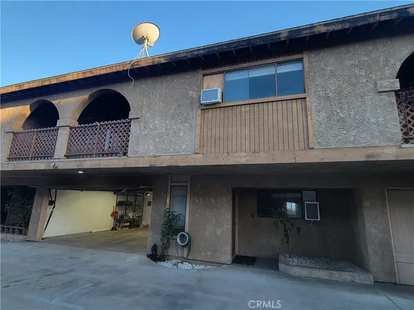 a front view of a house with parking