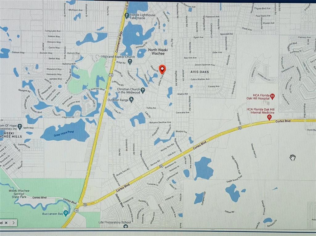 Indian Trail Road Weeki Wachee, FL 34613 - Photo 11 of 13 a view of bathroom with bathtub and dryer