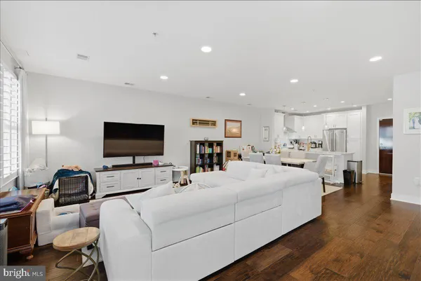 a room with a bed and a flat screen tv