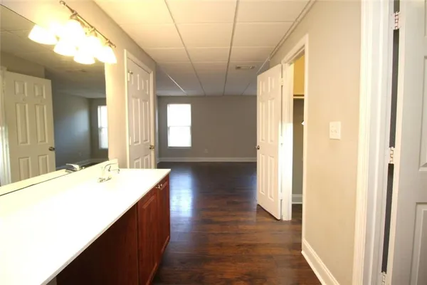 a bathroom with a double vanity sink and mirror