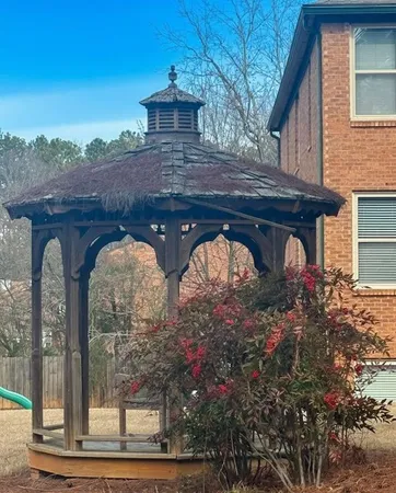 a view of a yard with a bench
