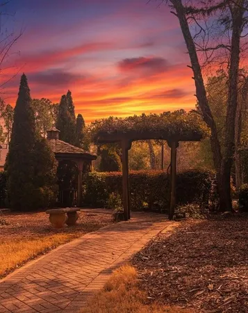 a wooden deck with sunset view