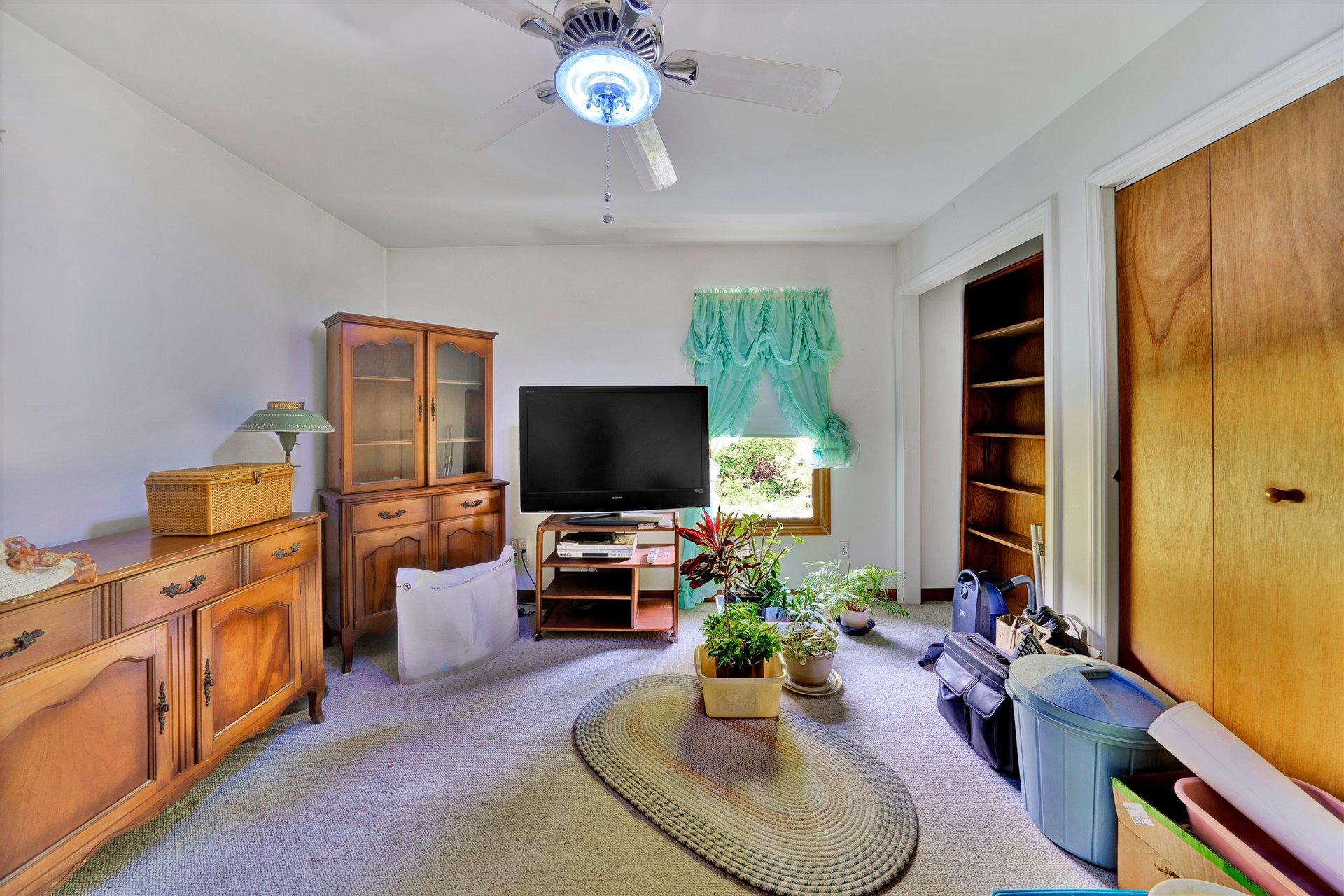 1401 Treasure Lane Blue Ridge, VA 24064 - Photo 13 of 23 a living room with furniture and a flat screen tv