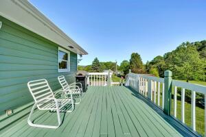 1401 Treasure Lane Blue Ridge, VA 24064 - Photo 17 of 23 a balcony with wooden floor table and chairs