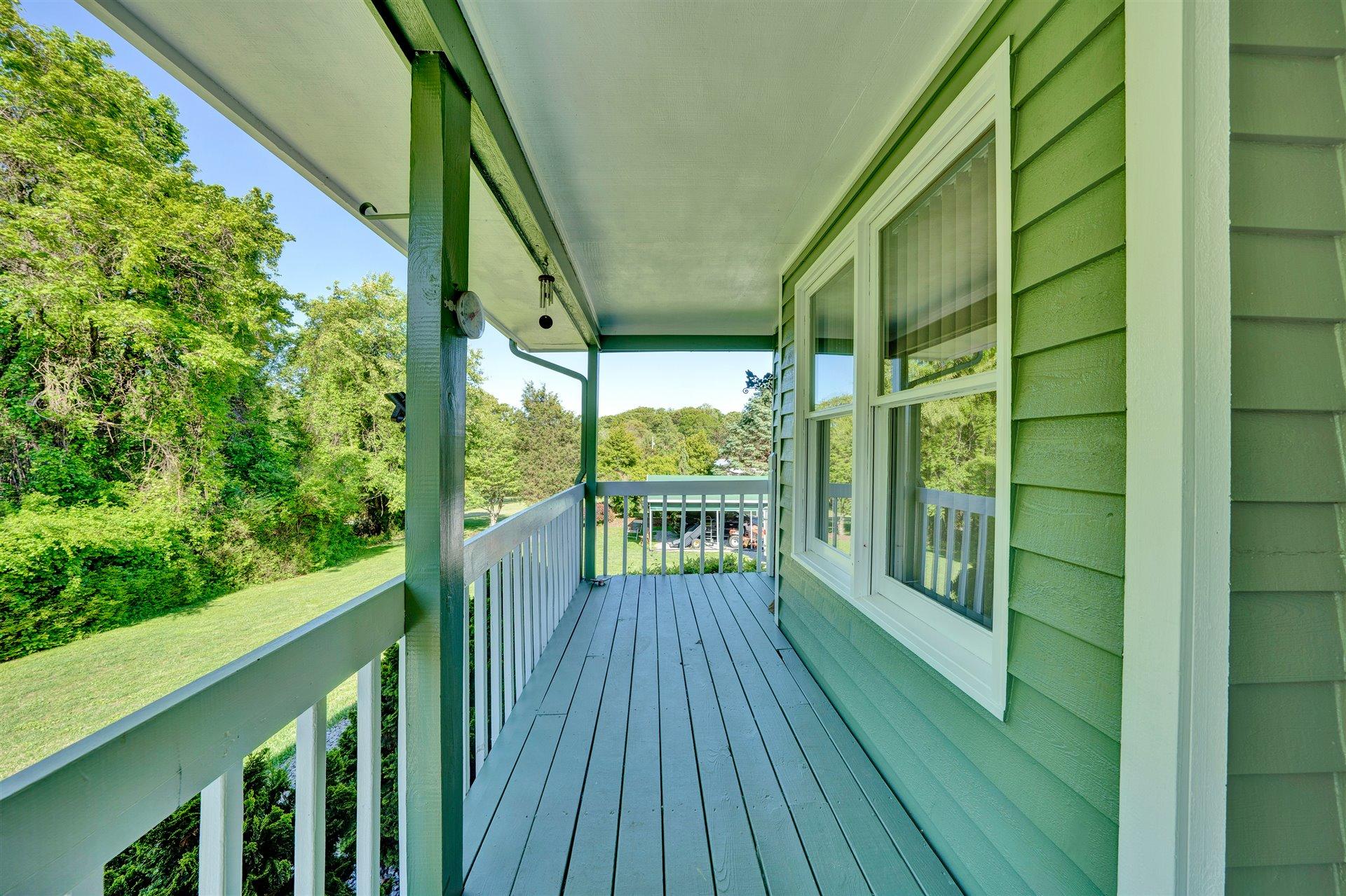1401 Treasure Lane Blue Ridge, VA 24064 - Photo 3 of 23 a view of balcony with wooden floor