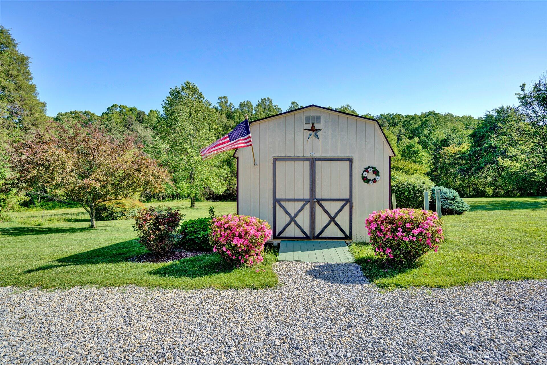 1401 Treasure Lane Blue Ridge, VA 24064 - Photo 21 of 23 a front view of a house with a yard