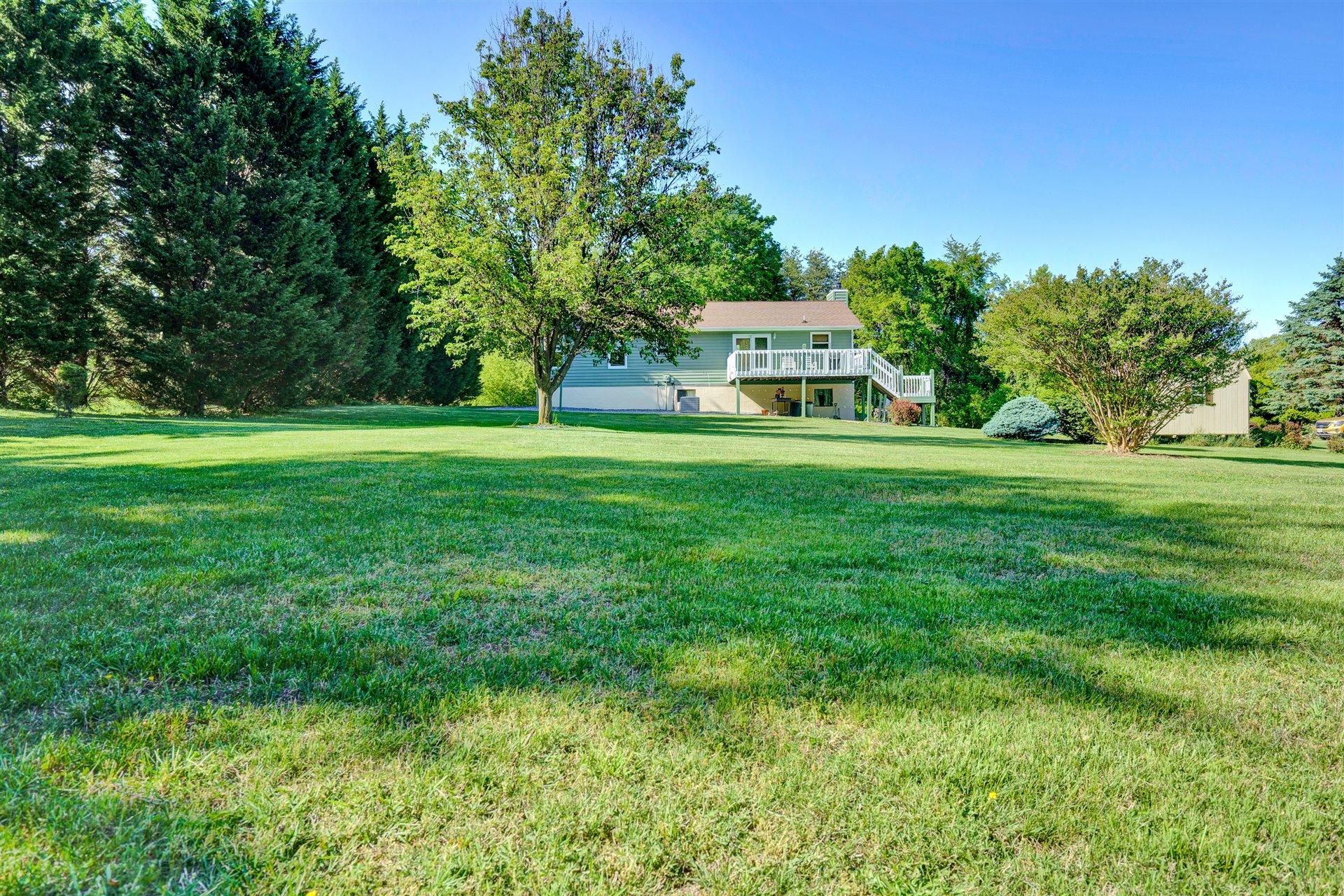 1401 Treasure Lane Blue Ridge, VA 24064 - Photo 23 of 23 a front view of a house with a garden