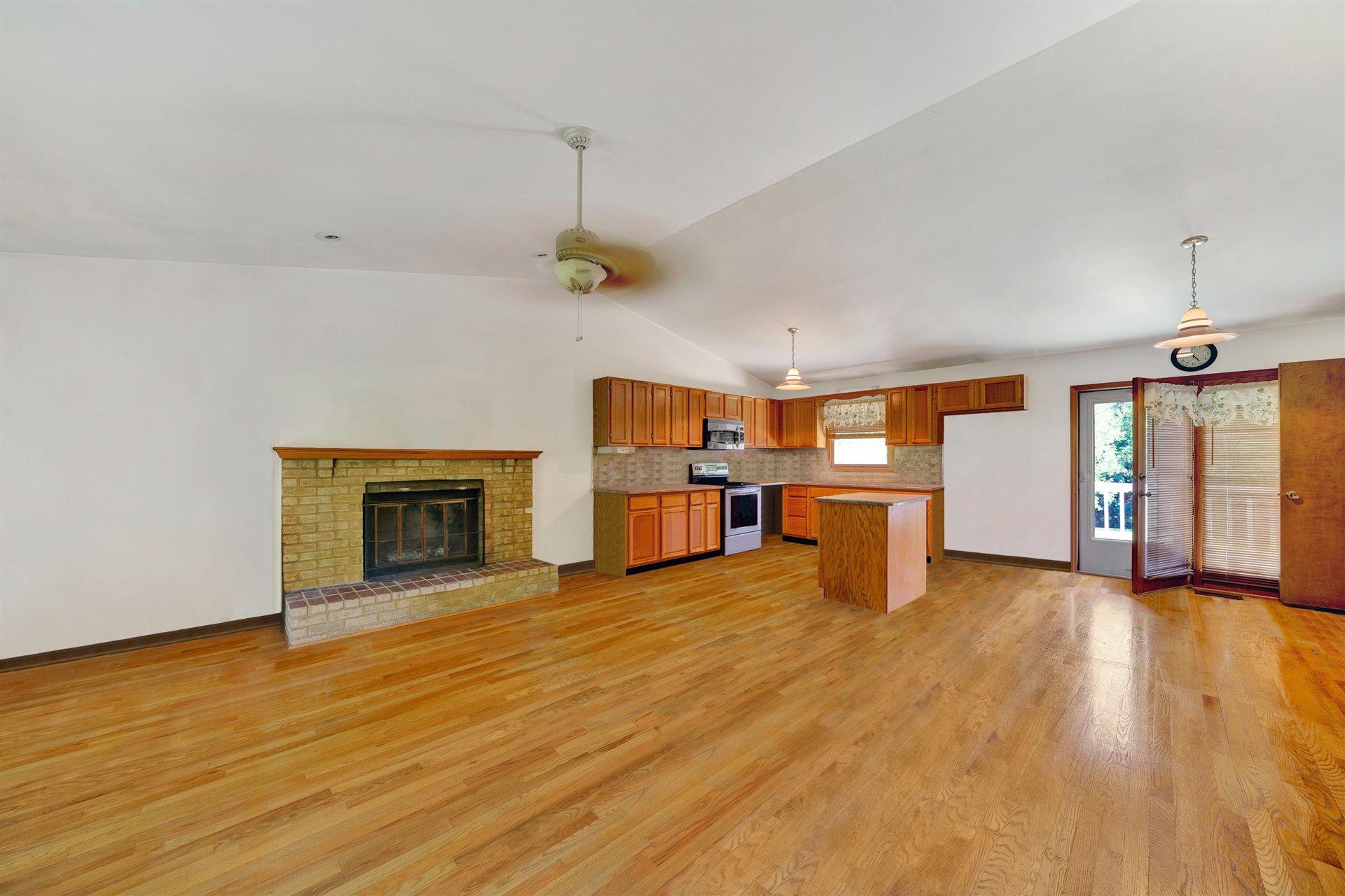 1401 Treasure Lane Blue Ridge, VA 24064 - Photo 6 of 23 a view of a kitchen with a sink and a fireplace