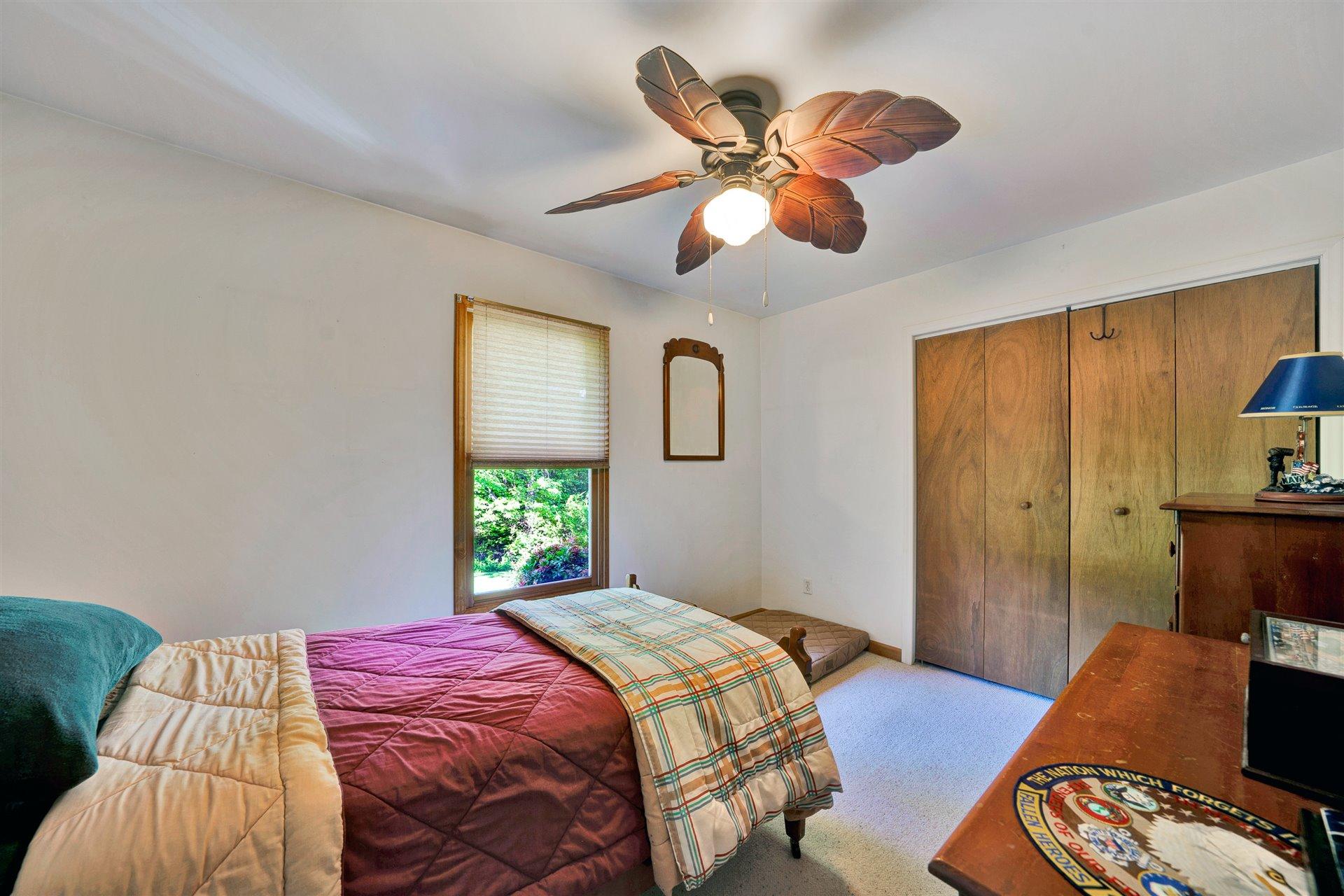 1401 Treasure Lane Blue Ridge, VA 24064 - Photo 10 of 23 a bedroom with a bed and wooden floor