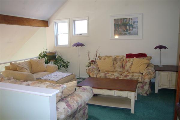 21 Autumn Road Medway, MA 02053 - Photo 13 of 13 a living room with furniture and a potted plant