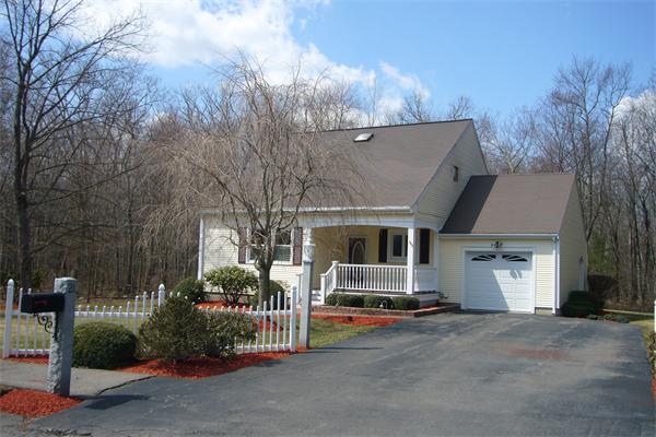21 Autumn Road Medway, MA 02053 - Photo 4 of 13 a view of a house with a yard and garage