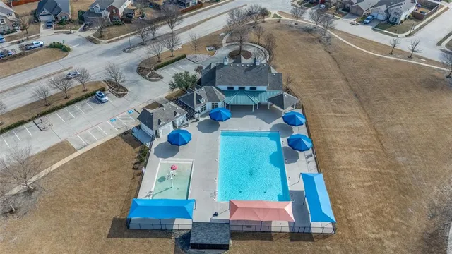 an aerial view of residential house with outdoor space