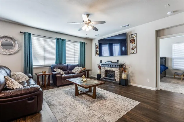 a living room with furniture and a fireplace