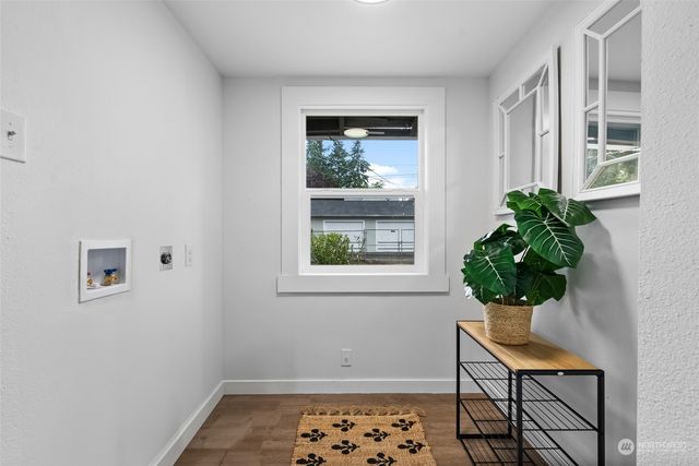 a view of a door and chair in a room