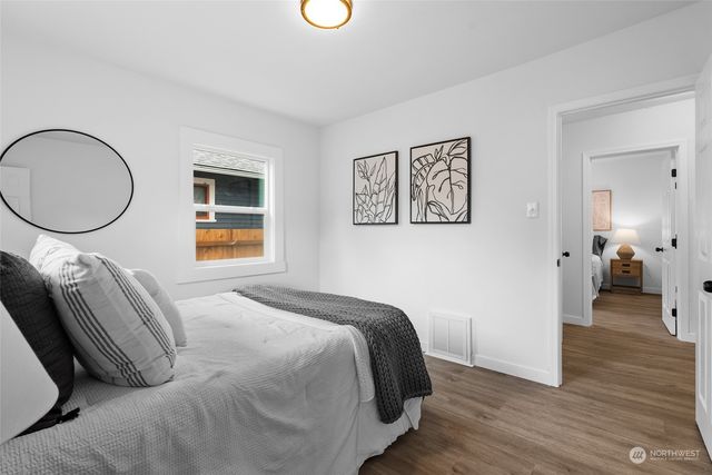 a bedroom with a bed and a lamp