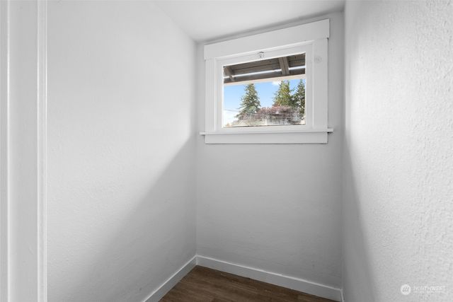 a bedroom with bed and a window