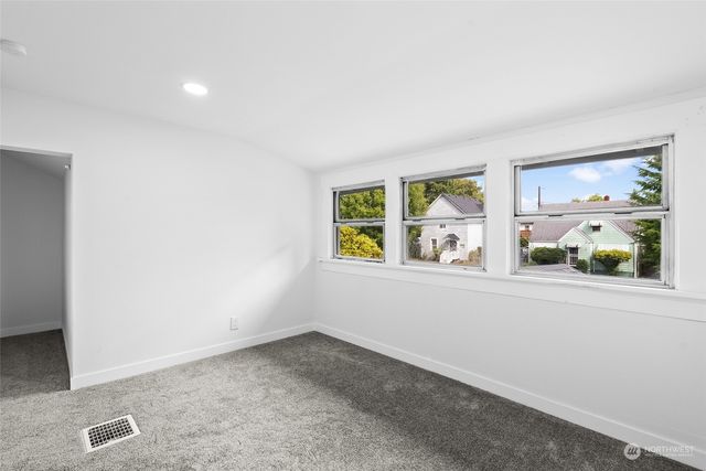 a bathroom with a bathtub sink vanity and mirror