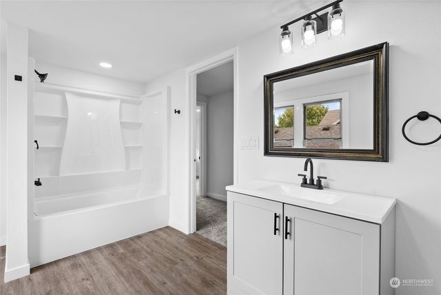 a front view of a house with potted plants