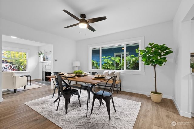 a view of a dining room with furniture window and wooden floor