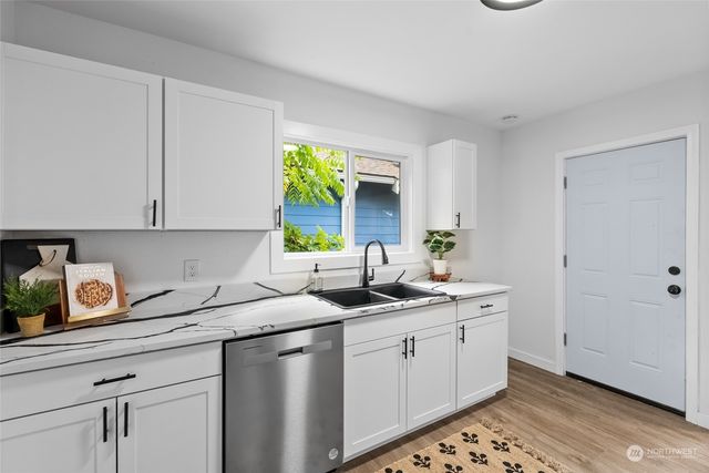 a kitchen with a sink and cabinets