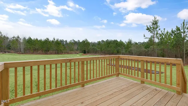 a view of a balcony with wooden floor