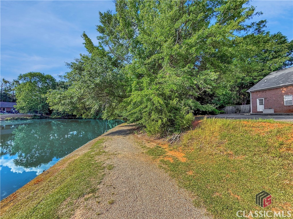 445 Logmont Trace, Unit 17 Athens, GA 30606 - Photo 27 of 28 View behind Townhome to a pond that is part of another community