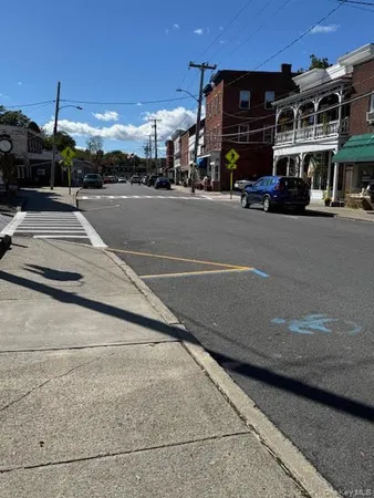 a view of a street with cars