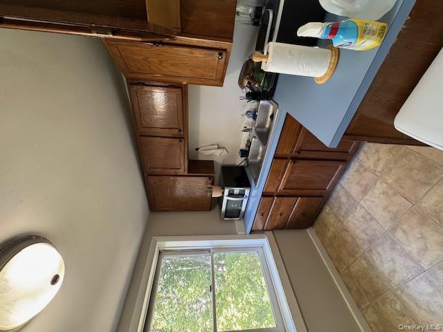 282 Main Street, Unit 1 Cornwall, NY 12518 - Photo 8 of 22 a kitchen with a stove a sink and a cabinets