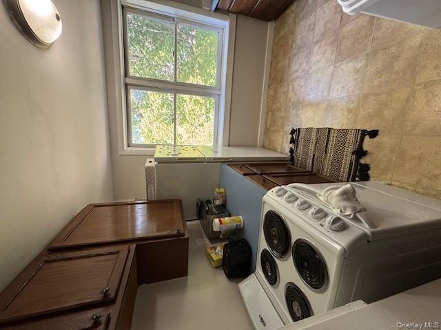 282 Main Street, Unit 1 Cornwall, NY 12518 - Photo 9 of 22 a kitchen with a stove a sink and a refrigerator