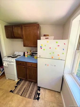 a utility room with cabinets washer and dryer