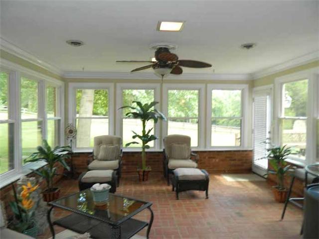 4517 Chandler Road Hermitage, TN 37076 - Photo 13 of 20 Florida Room: 17 x15 Terrific room for relaxing or entertaining—Offering a one of kind view , brick floor, & walls, all new windows, freshly painted, ceiling fan, access to the deck, and French Doors lead to the Dining Room