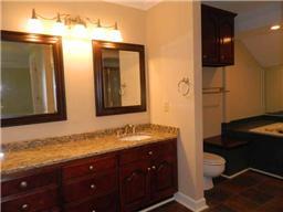 4517 Chandler Road Hermitage, TN 37076 - Photo 18 of 20 Full Bathroom located on the second level featuring 2 vanity areas, separate shower and an oversized jetted tub with mirrored wall