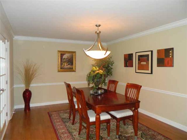 4517 Chandler Road Hermitage, TN 37076 - Photo 9 of 20 Dining Room: 16x12 Spacious in design & suitable for large gatherings, this elegant room offers new hardwood flooring, chair-rail, crown molding, new chandelier, cased doorway into the Kitchen area and cased opening into the Greatroom