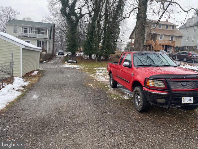 5605 Liberty Heights Avenue Baltimore, MD 21207 - Photo 2 of 6 a front view of a house with parking space